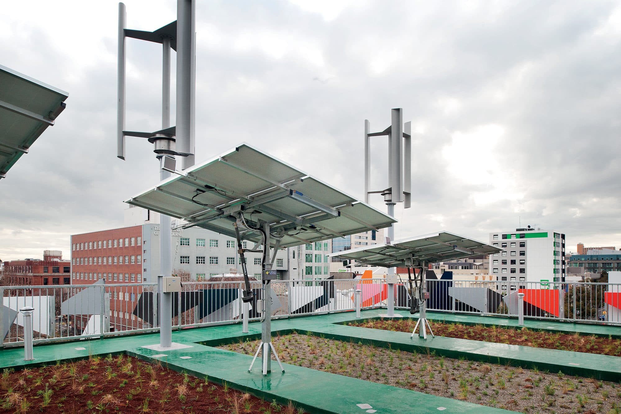 Pixel Building green roof with PV panels and wind turbines.